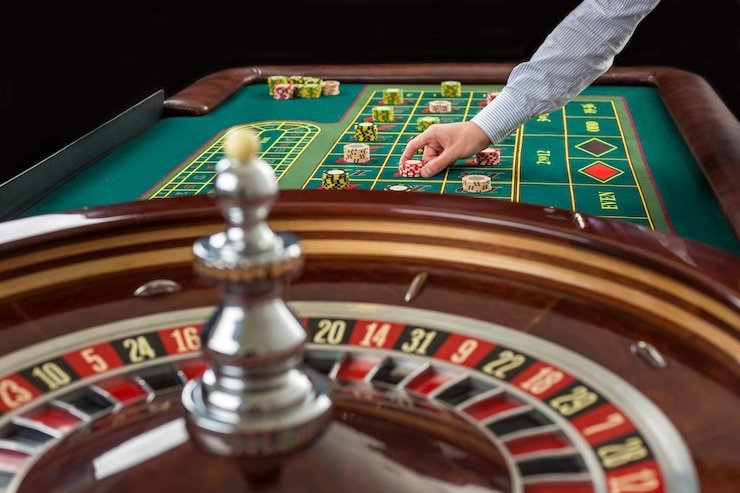 Live AduQ dealer table with card layout and player positions